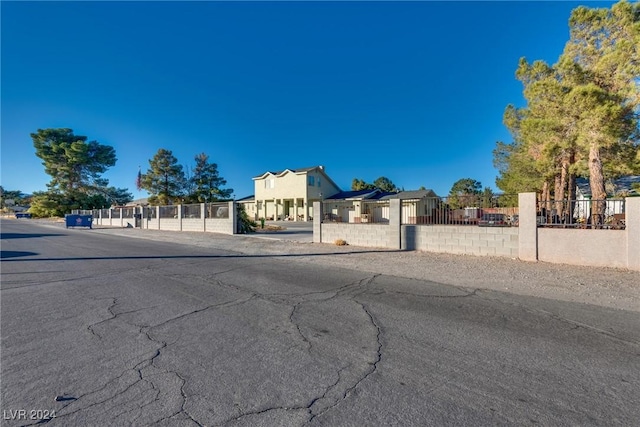 exterior space featuring a fenced front yard and a gate