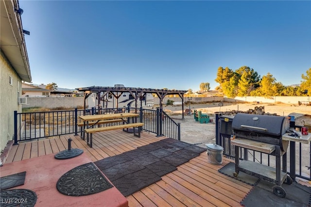 wooden terrace featuring fence and a pergola