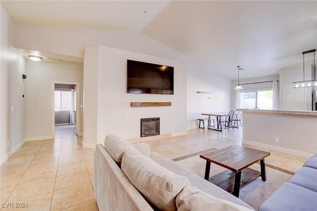 tiled living room with vaulted ceiling