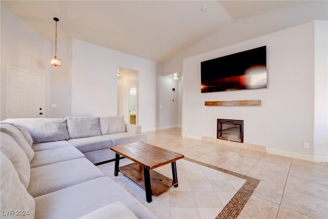 living room with lofted ceiling and light tile patterned floors