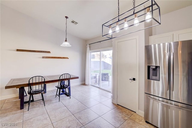 dining space with light tile patterned floors