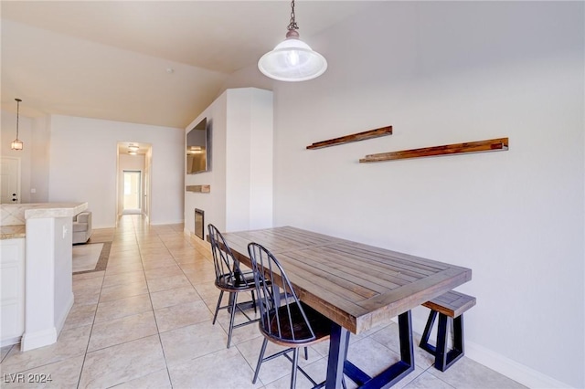 dining area with light tile patterned floors