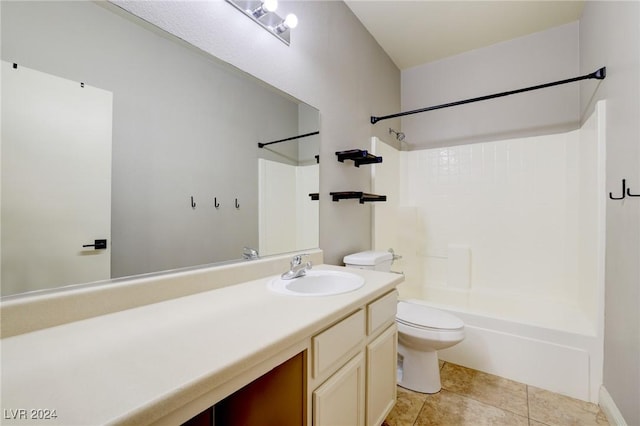 full bathroom featuring tile patterned flooring, vanity, toilet, and washtub / shower combination