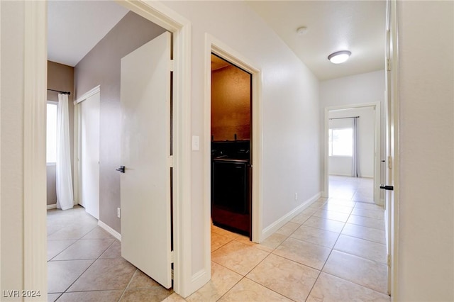 hallway featuring light tile patterned floors