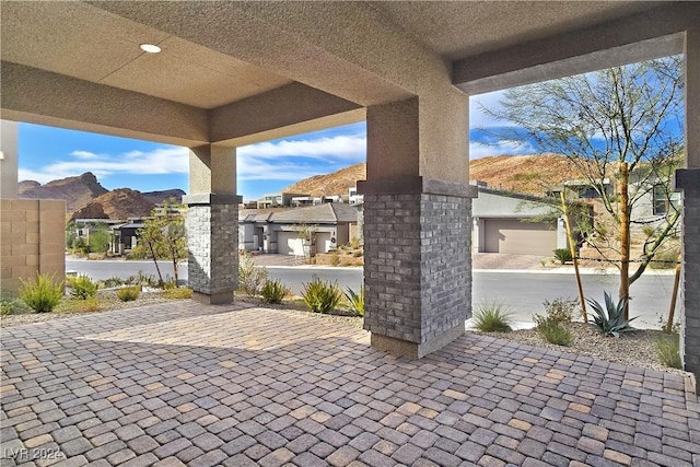 view of patio / terrace with a mountain view