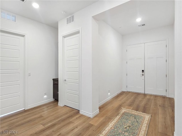 entrance foyer with light hardwood / wood-style flooring