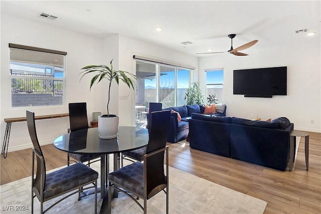 dining room featuring ceiling fan and light hardwood / wood-style floors