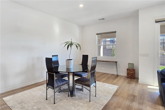 dining space featuring light hardwood / wood-style flooring