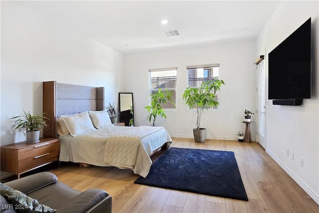 bedroom with light hardwood / wood-style flooring