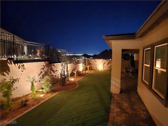 view of yard at night