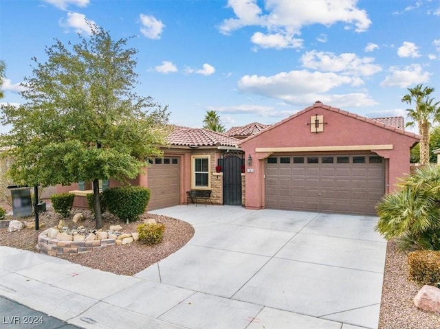 mediterranean / spanish house featuring a garage