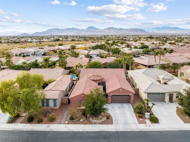 birds eye view of property featuring a mountain view