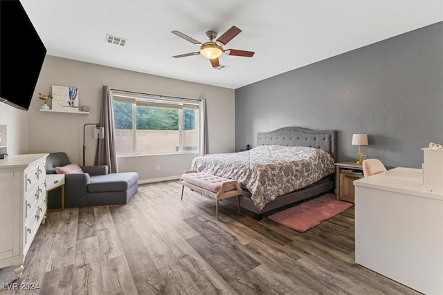 bedroom featuring ceiling fan and wood-type flooring