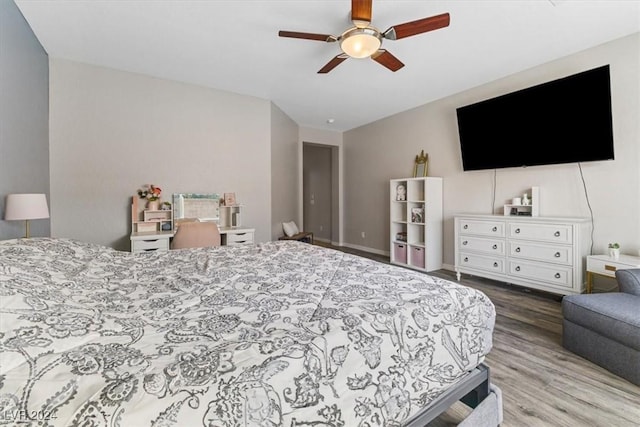 bedroom with hardwood / wood-style flooring and ceiling fan