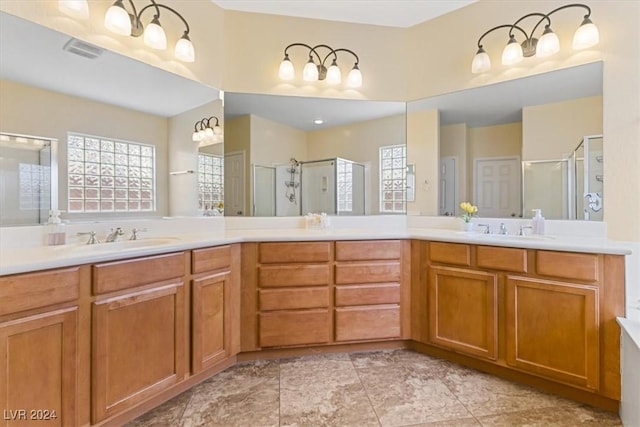 bathroom featuring vanity, tile patterned floors, and an enclosed shower