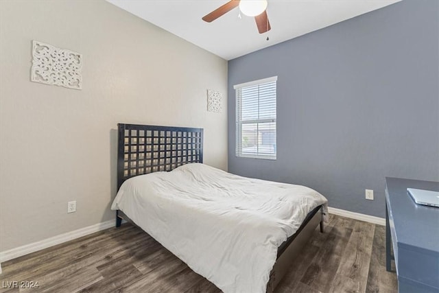 bedroom featuring dark hardwood / wood-style floors and ceiling fan