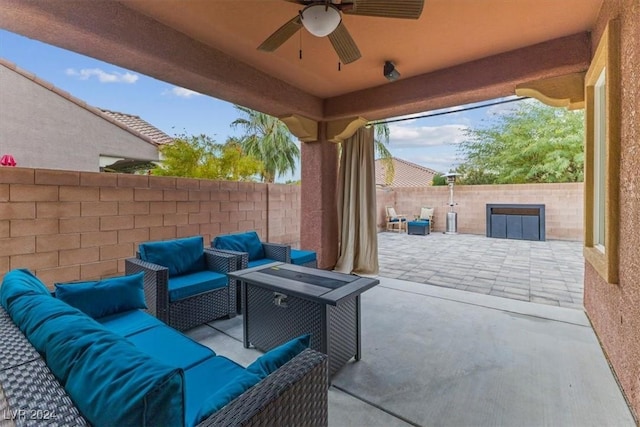 view of patio with outdoor lounge area and ceiling fan