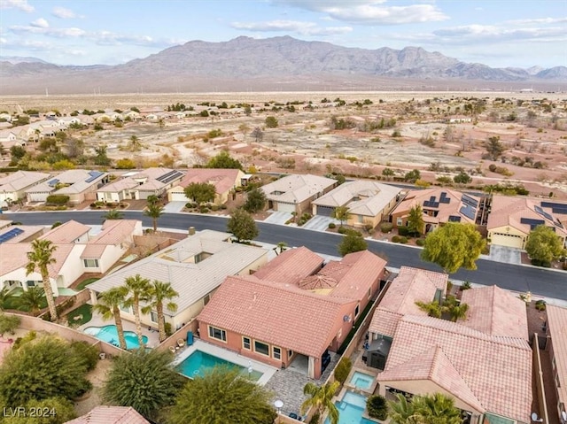 birds eye view of property featuring a mountain view