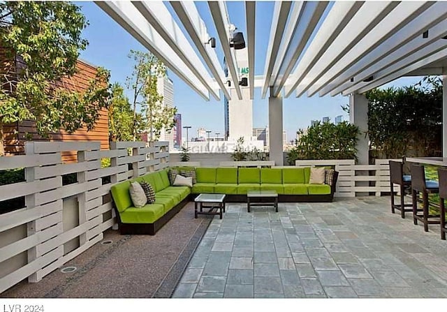 view of patio with outdoor lounge area and a pergola