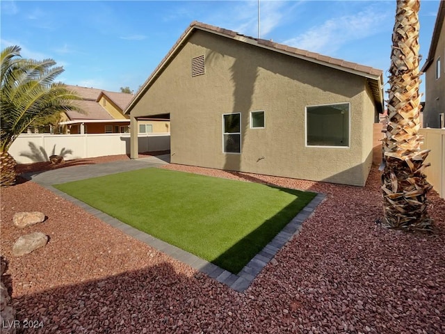 back of house with a patio area