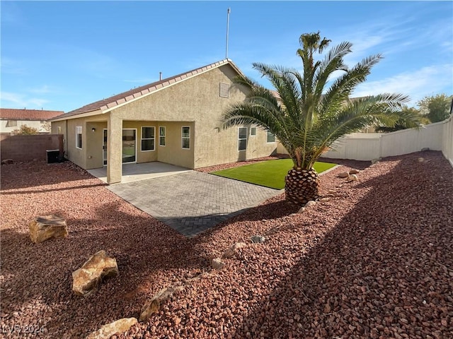 rear view of property with a patio area