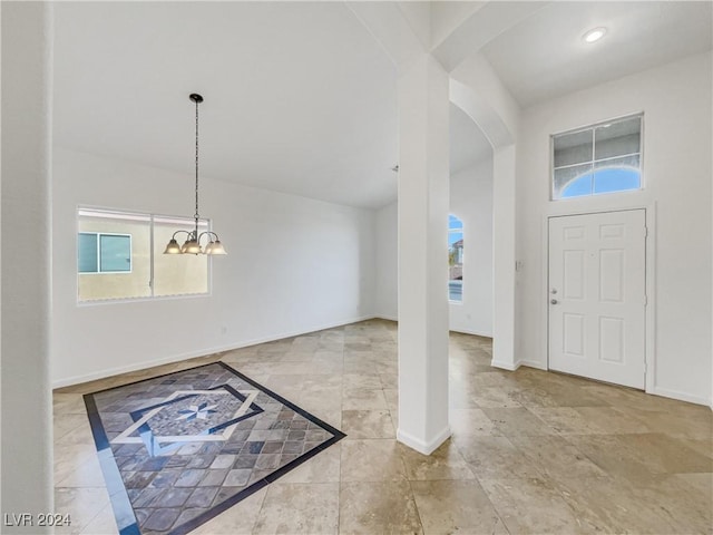 entryway with a chandelier and a healthy amount of sunlight