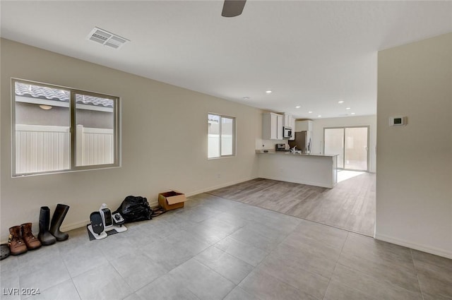 unfurnished living room with light wood-type flooring