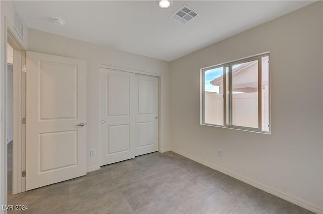 unfurnished bedroom with a closet