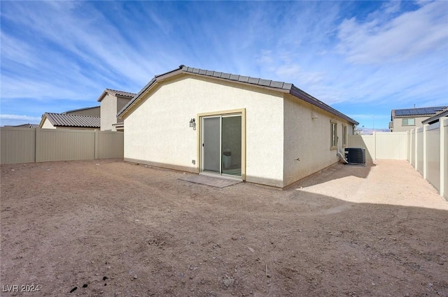 rear view of house with cooling unit