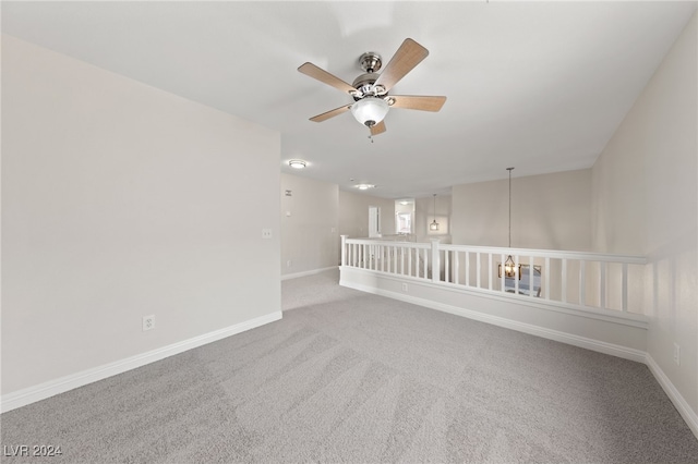 carpeted empty room with ceiling fan