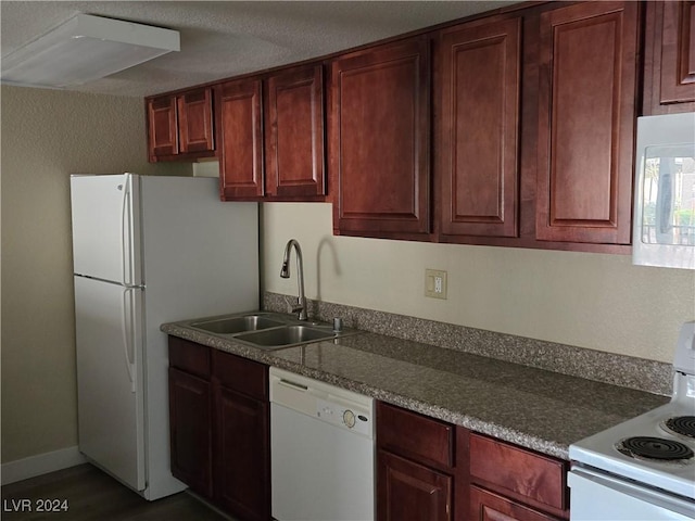 kitchen featuring sink and white appliances