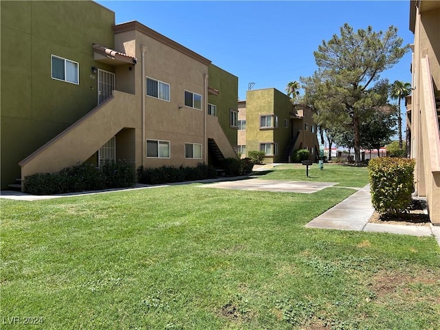 view of home's community with a lawn