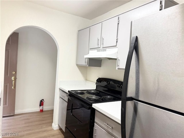 kitchen with white cabinets, light wood-type flooring, stainless steel refrigerator, and black range with electric stovetop