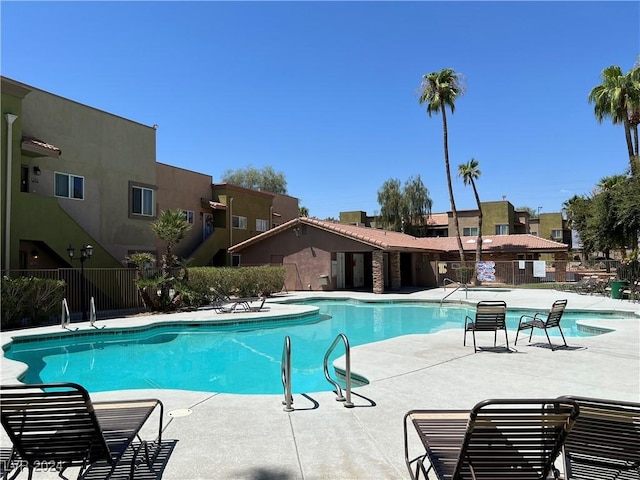 view of swimming pool with a patio area