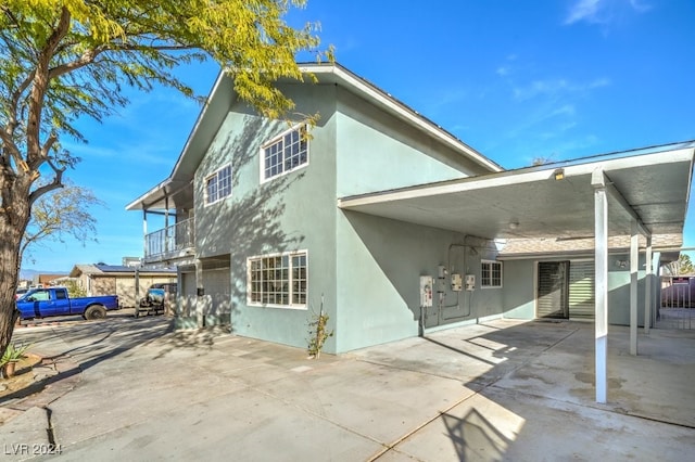 rear view of house with a garage