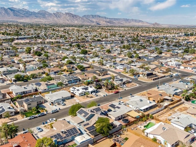 birds eye view of property with a mountain view