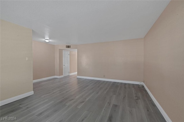 empty room featuring hardwood / wood-style floors