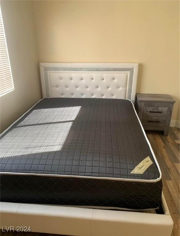 unfurnished bedroom featuring dark hardwood / wood-style floors