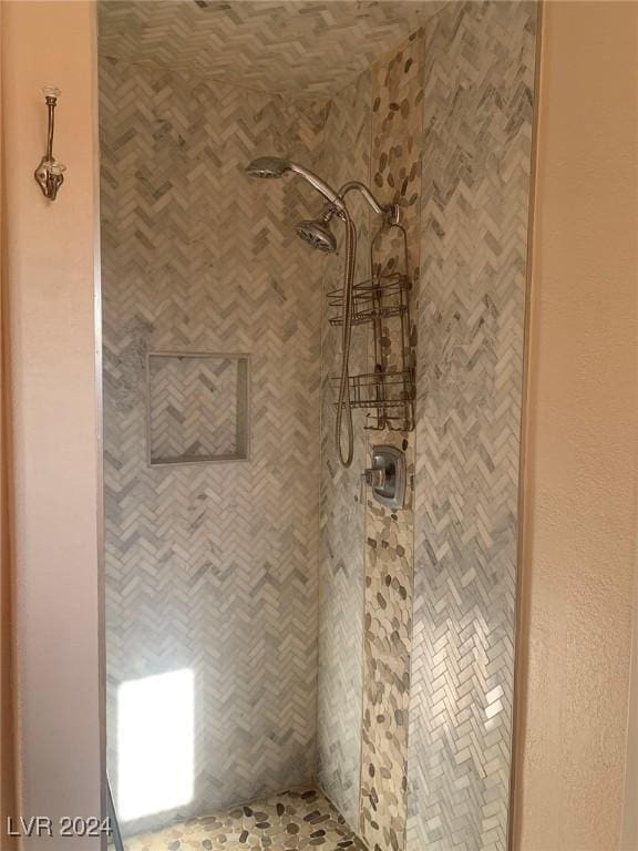 bathroom with tiled shower