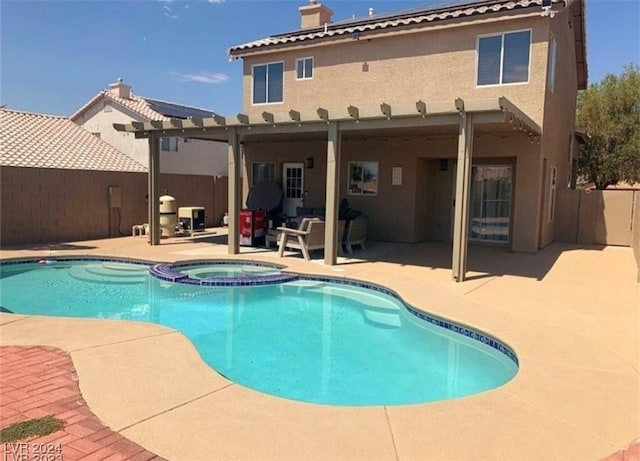 view of swimming pool with a pergola, a patio area, an in ground hot tub, and an outdoor living space