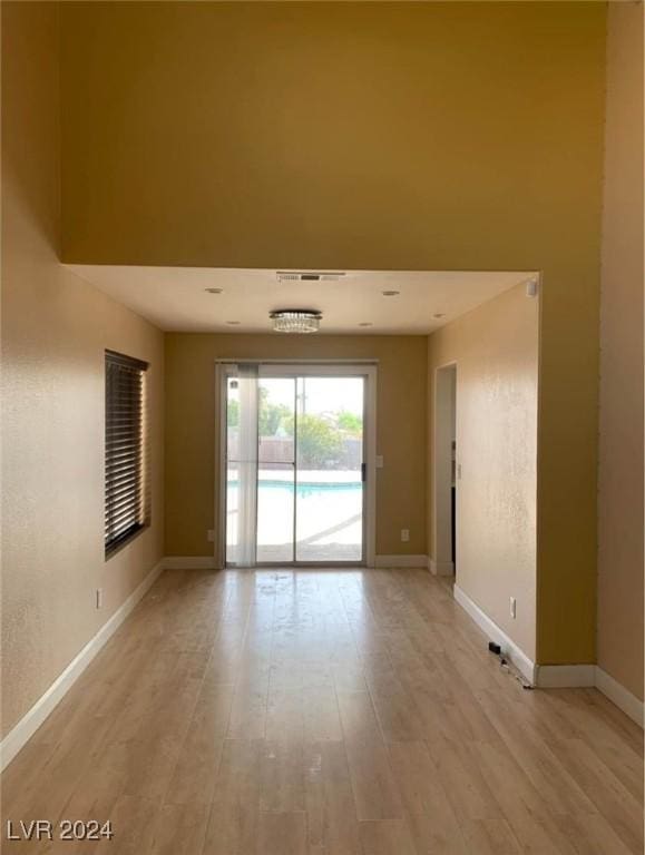 unfurnished room featuring light hardwood / wood-style floors