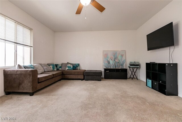 living room with carpet flooring and ceiling fan