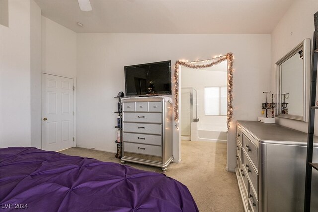 carpeted bedroom with ceiling fan and lofted ceiling