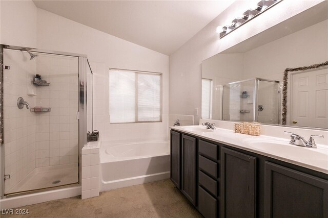 bathroom featuring vanity, plus walk in shower, and vaulted ceiling