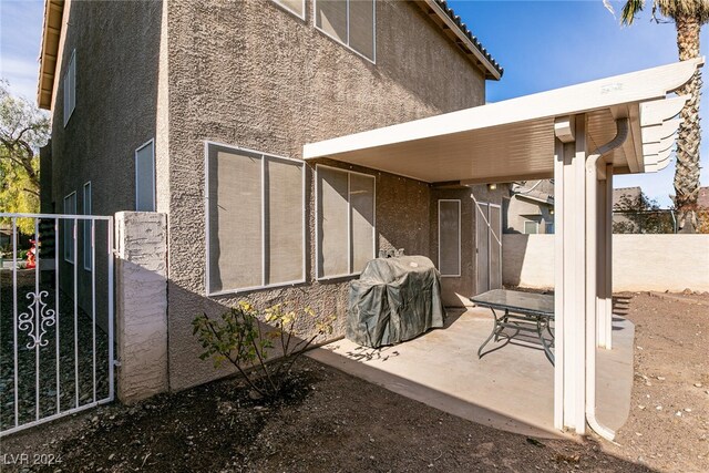 rear view of property featuring a patio area