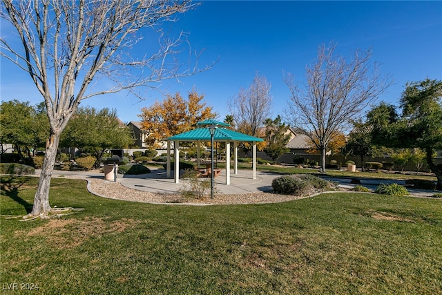 surrounding community featuring a gazebo and a lawn