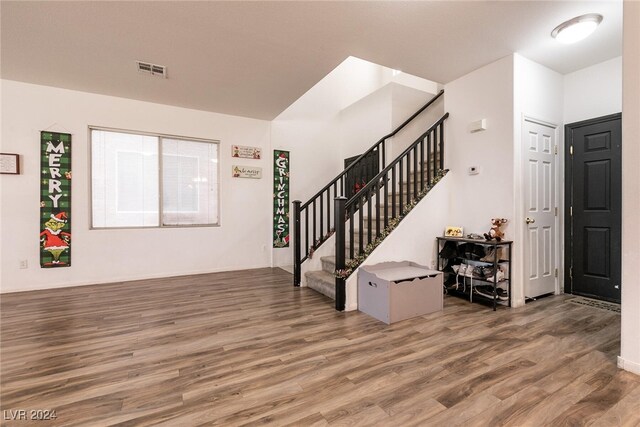 entryway with hardwood / wood-style flooring