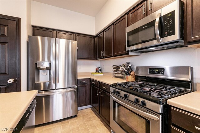 kitchen featuring dark brown cabinetry and stainless steel appliances