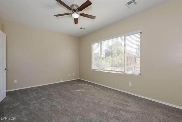 carpeted empty room featuring ceiling fan