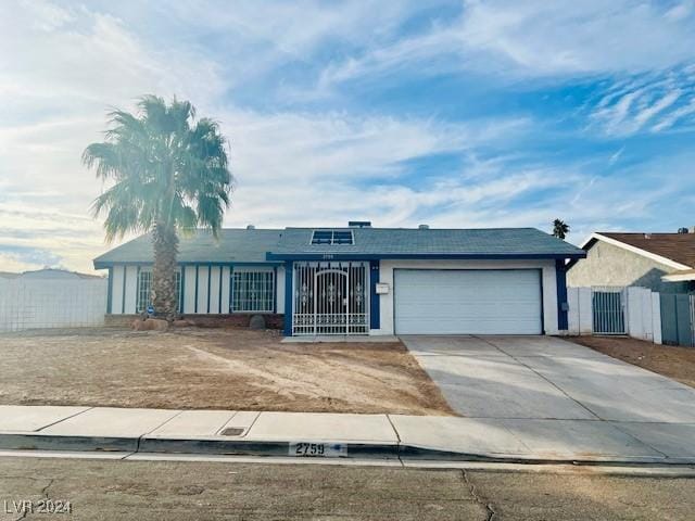 single story home featuring a garage